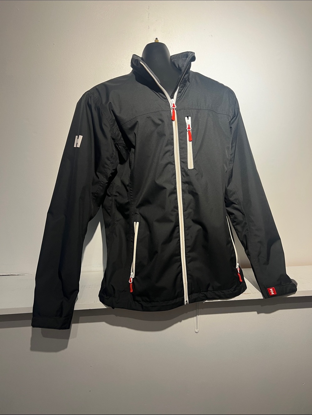 Helly Hansen Black Windbreaker Jacket with White Zippers and Red Accents